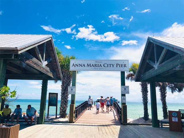 dock area with a water view and a gazebo