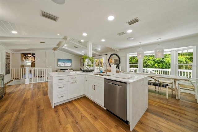 kitchen featuring light hardwood / wood-style flooring, dishwasher, white cabinetry, and plenty of natural light