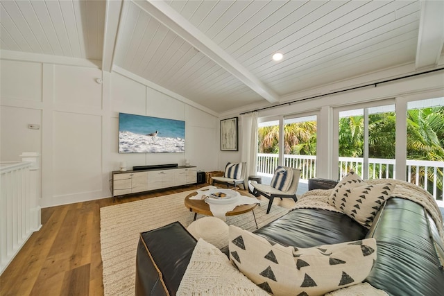 living room featuring vaulted ceiling with beams, wooden ceiling, and light hardwood / wood-style floors