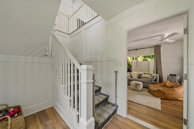 stairs featuring light hardwood / wood-style floors