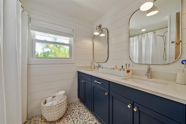 bathroom featuring double vanity and wooden walls