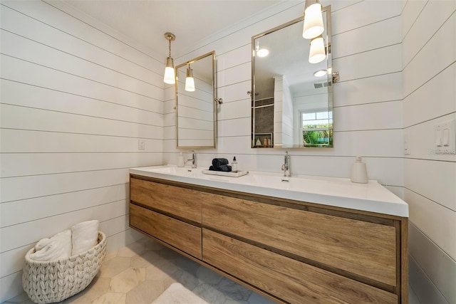 bathroom with double vanity and tile patterned floors