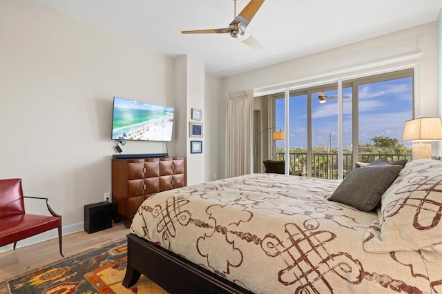 bedroom featuring ceiling fan, access to exterior, and wood-type flooring