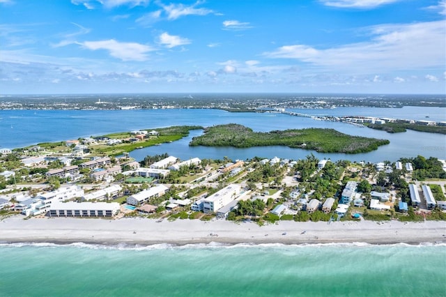 birds eye view of property featuring a view of the beach and a water view