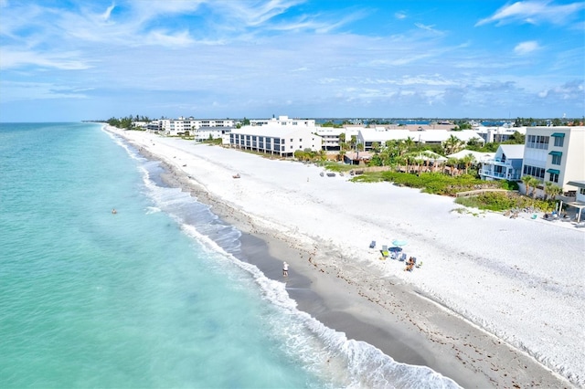 bird's eye view with a view of the beach and a water view