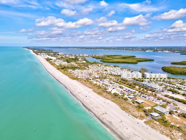 birds eye view of property with a beach view and a water view