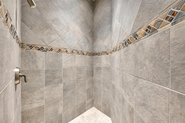 bathroom with tiled shower