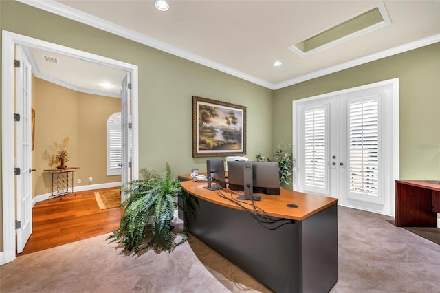 home office with crown molding, hardwood / wood-style floors, and french doors