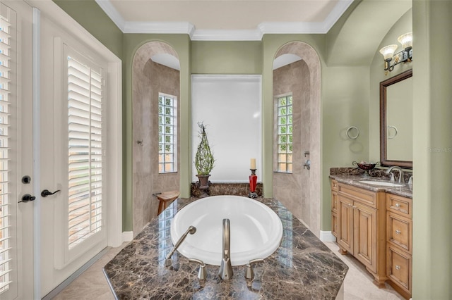 bathroom with a relaxing tiled tub, ornamental molding, and vanity