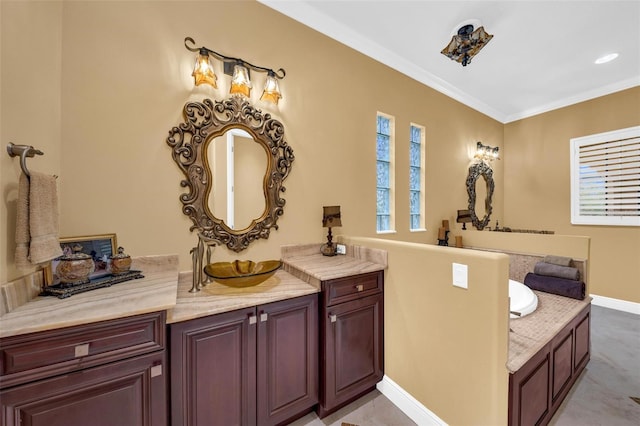 bathroom featuring vanity, a washtub, and ornamental molding