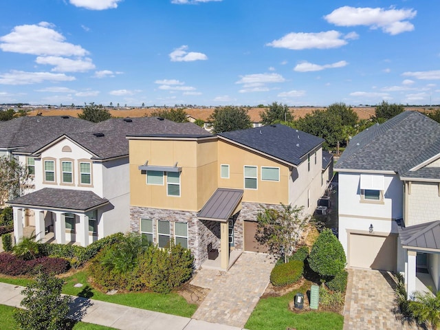 view of front of property with a garage