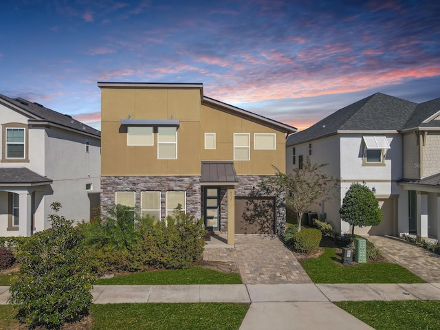 view of front of home with a garage