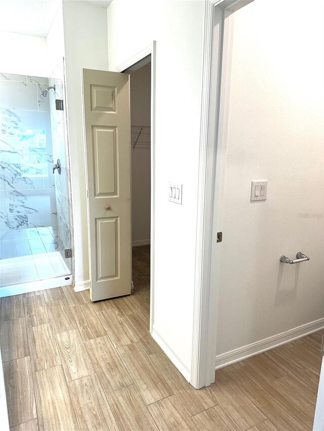 hallway with light wood-type flooring