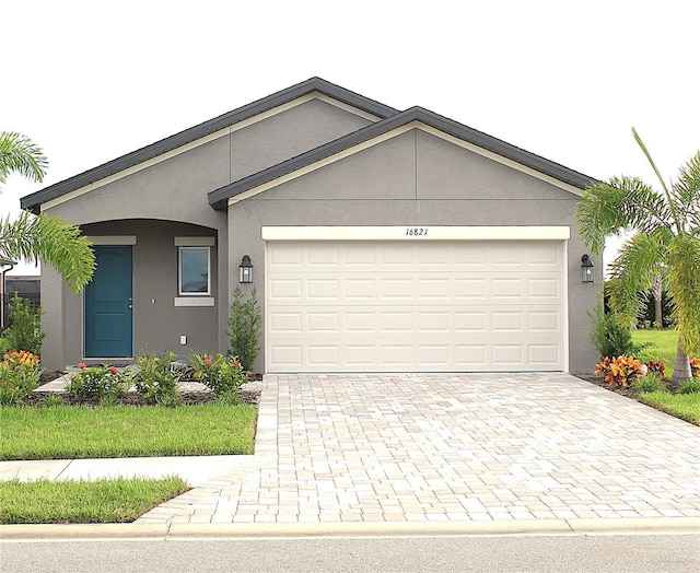 ranch-style home with a garage