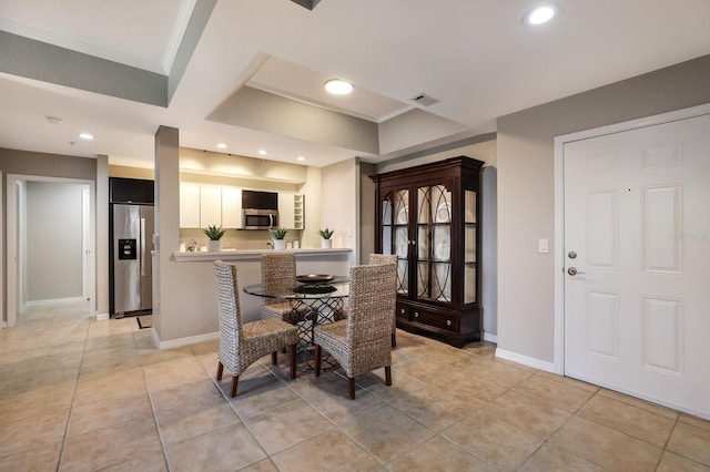 dining space featuring light tile patterned floors