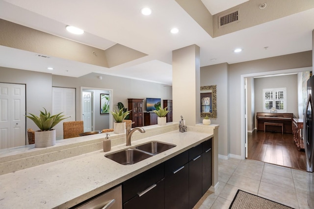 kitchen with sink and light hardwood / wood-style flooring