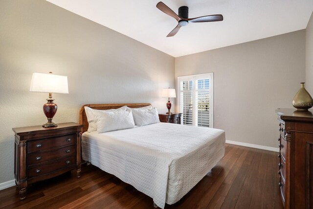 bedroom with lofted ceiling, ceiling fan, and dark hardwood / wood-style floors