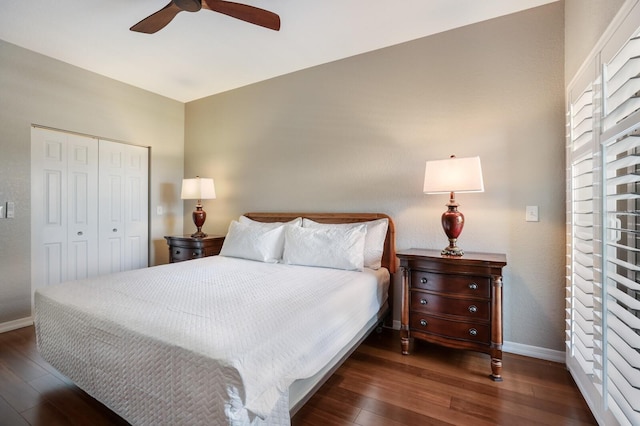 bedroom featuring ceiling fan, a closet, and dark wood-type flooring