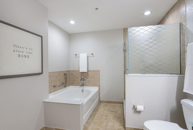 bathroom with tile patterned flooring, separate shower and tub, and toilet