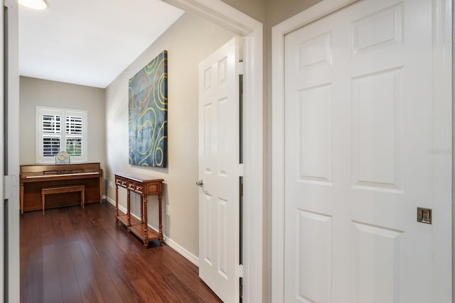 hallway with dark hardwood / wood-style floors