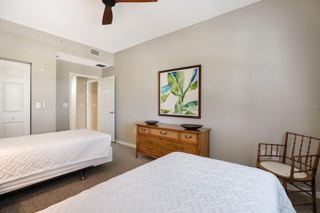 carpeted bedroom with ceiling fan and a closet