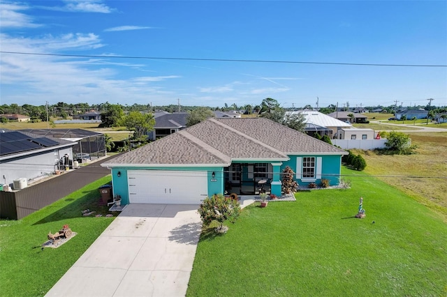 ranch-style home with a garage and a front lawn