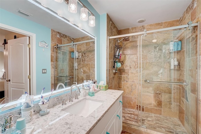 bathroom with vanity and walk in shower