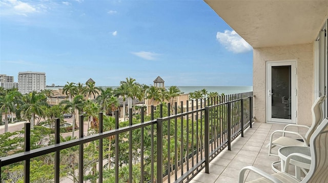 balcony featuring a water view