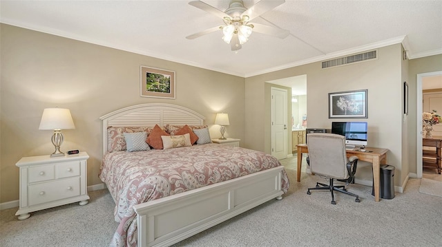 carpeted bedroom with ceiling fan and crown molding