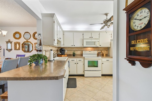 kitchen with white appliances, sink, ceiling fan, light tile patterned floors, and tasteful backsplash