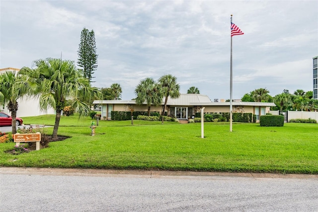 view of community featuring a yard