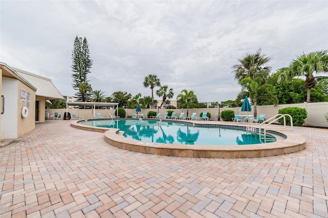 view of swimming pool featuring a patio area