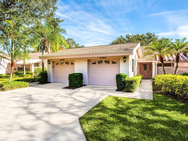 ranch-style home featuring a garage