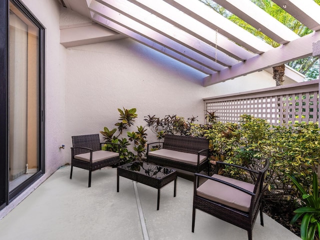 view of patio / terrace featuring a pergola and an outdoor hangout area