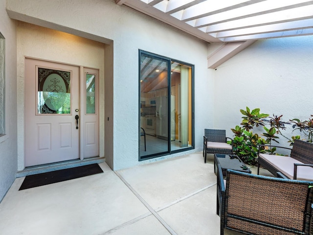 property entrance with a patio area