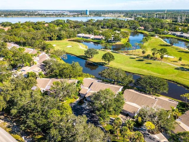 5424 Hampstead Heath Unit 28, Sarasota, FL 34235 - aerial view of residential area featuring a local golf course, a tree filled landscape, and a large body of water