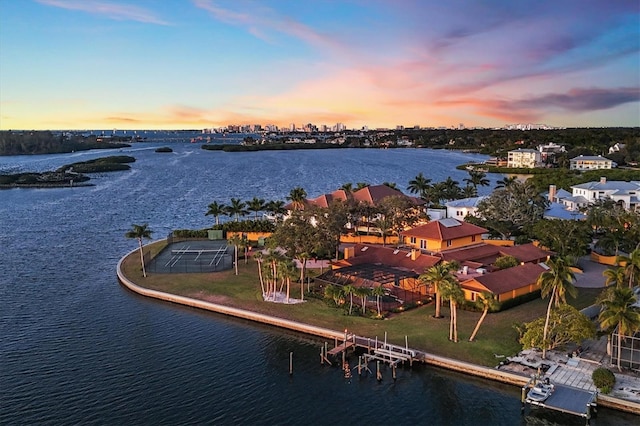 aerial view at dusk with a water view