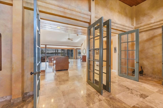 interior space with french doors and a high ceiling