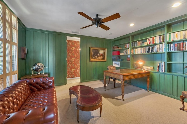 carpeted office space with built in shelves, recessed lighting, visible vents, and ceiling fan