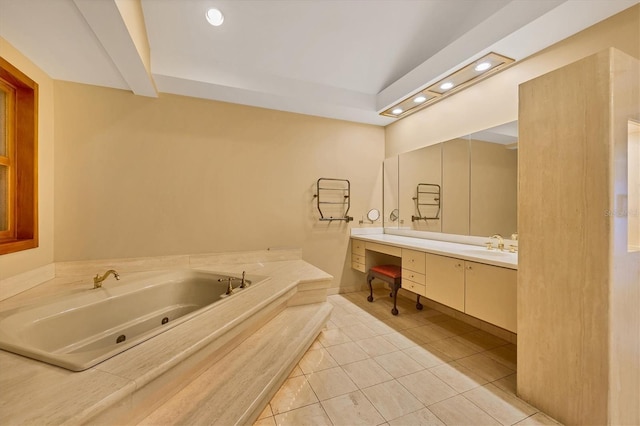 full bath featuring tile patterned floors, recessed lighting, a jetted tub, and vanity