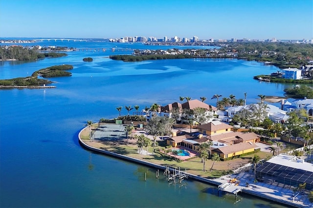 birds eye view of property featuring a view of city and a water view