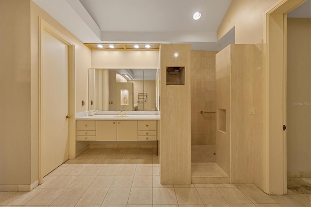 full bathroom with tile patterned floors, recessed lighting, a walk in shower, and vanity