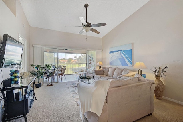 carpeted living room featuring high vaulted ceiling and ceiling fan