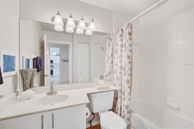 full bathroom featuring vanity, toilet, and shower / tub combo