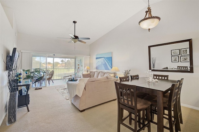 living room with carpet flooring, ceiling fan, and high vaulted ceiling