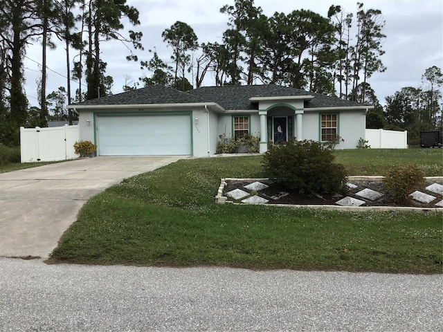 single story home with a garage and a front lawn