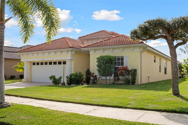 mediterranean / spanish house featuring a garage and a front lawn