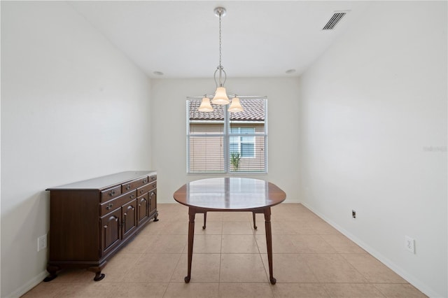 dining space with light tile patterned floors