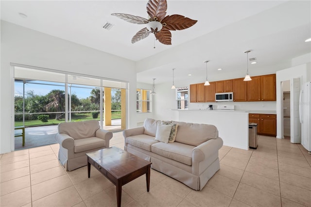 tiled living room featuring ceiling fan