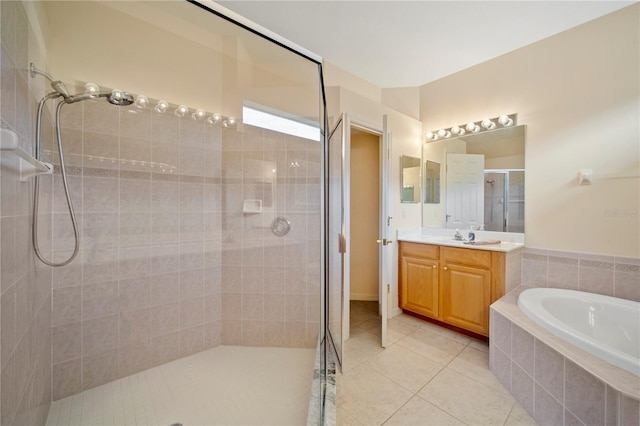 bathroom with tile patterned flooring, vanity, and plus walk in shower